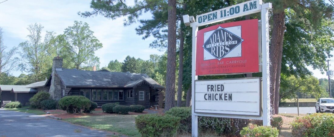 Adams Grille and Taphouse Prince Frederick Exterior with road sign